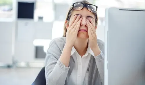 Worker with eye strain